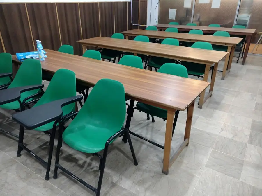 Rows of green chairs in a Pacans classroom